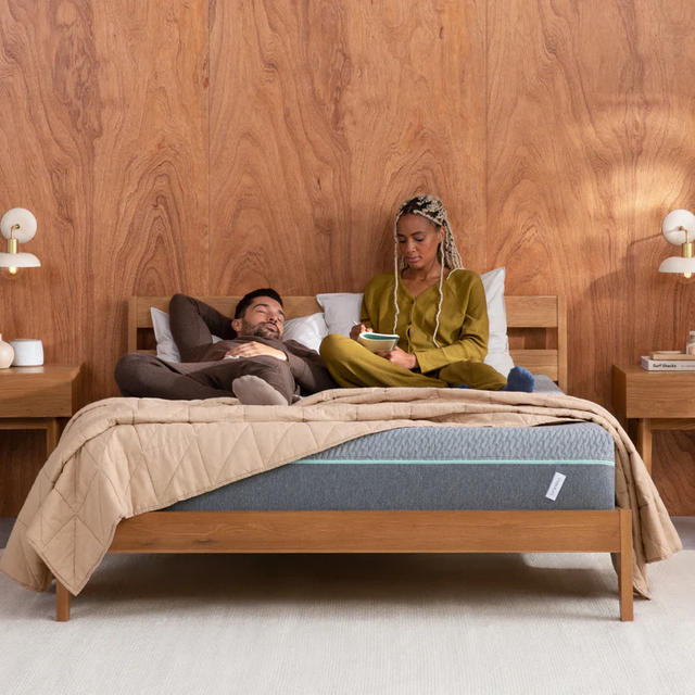 couple relaxing on tuft and needle mattress