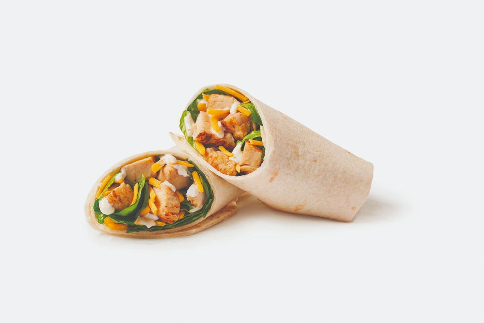 tortilla wrap filled with greens chicken cheese and dressing