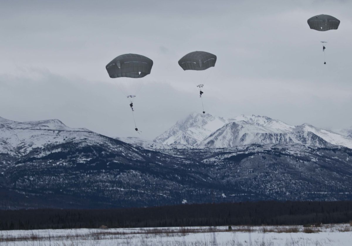 paratroopers with the 3rd battalion airborne, 509th infantry regiment, 4th infantry brigade combat team airborne, 25th infantry division, parachute onto malamute drop zone after exiting a uh 60 black hawk on joint base elmendorf richardson, alaska, nov 24, 2015 army photo by staff sgt brian ragin