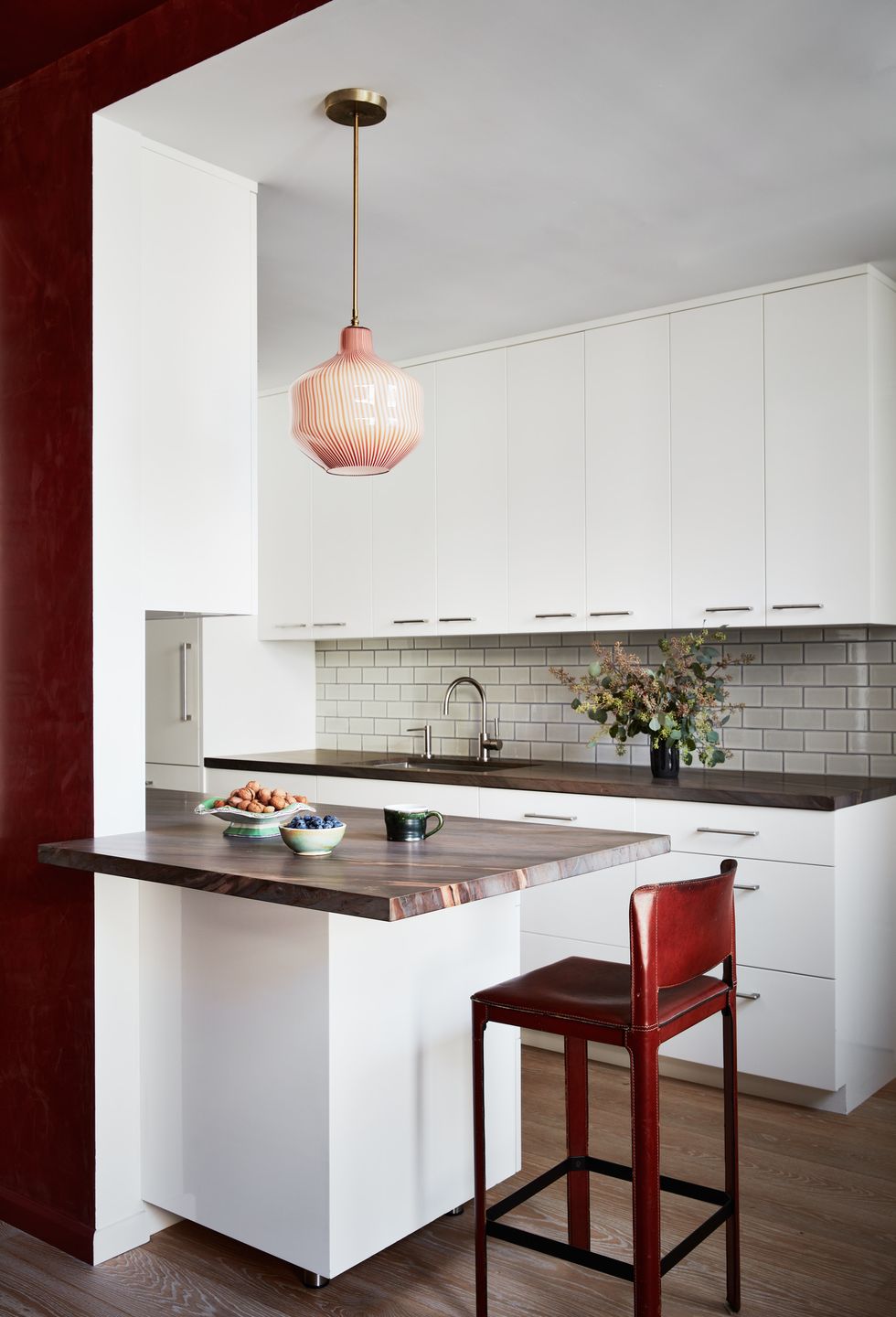 a kitchen with a red light