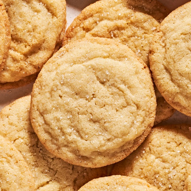 sugar cookies piled together in a counter