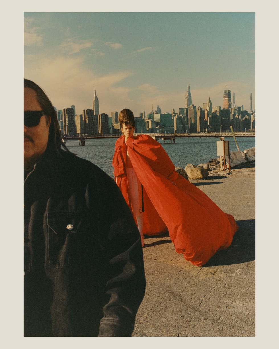 a man wearing a jacket and sunglasses