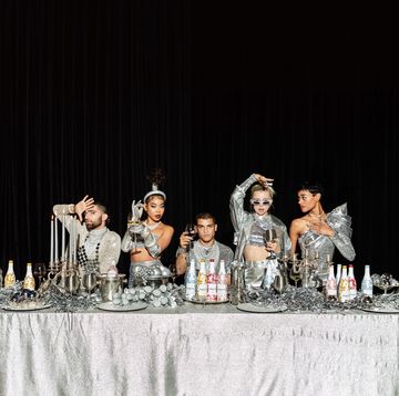 silver tablescape with models and wine bottles
