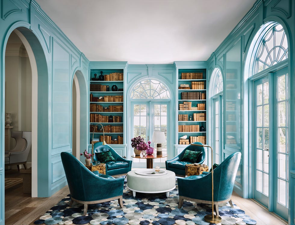 cozy living room featuring blue walls and furniture with a reading area