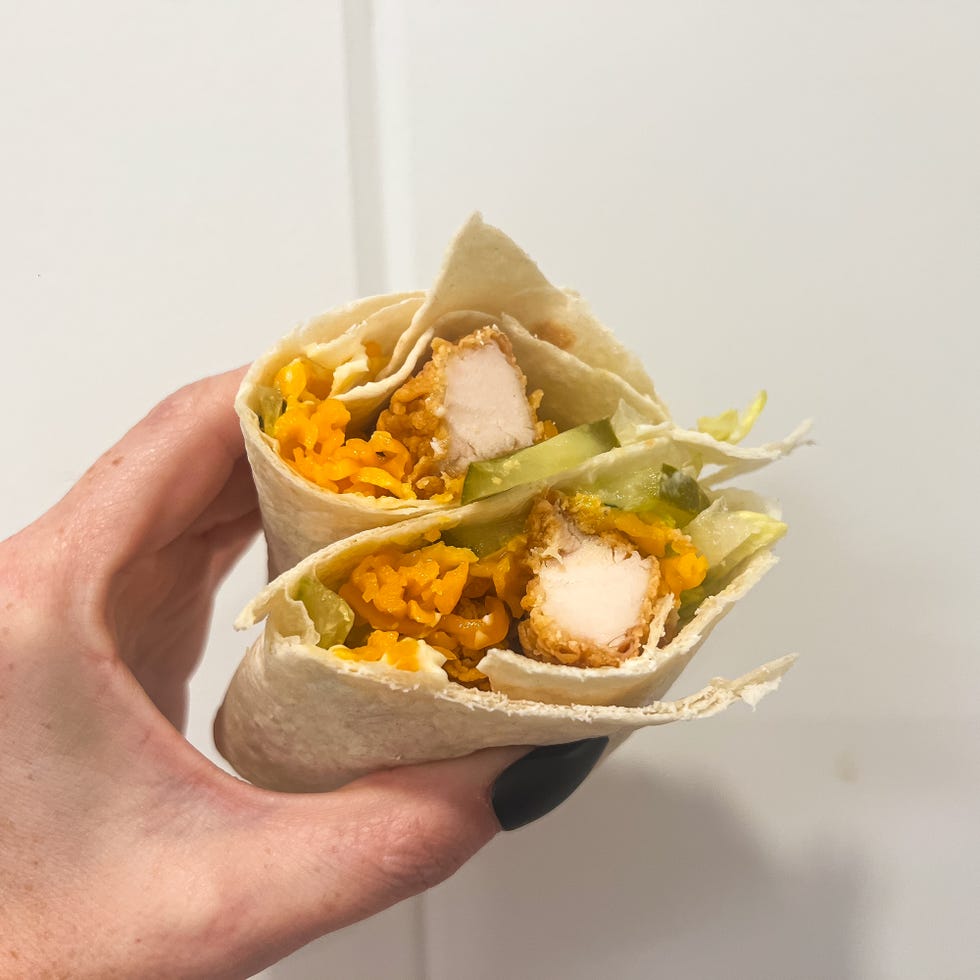 wrapped food containing chicken rice and vegetables