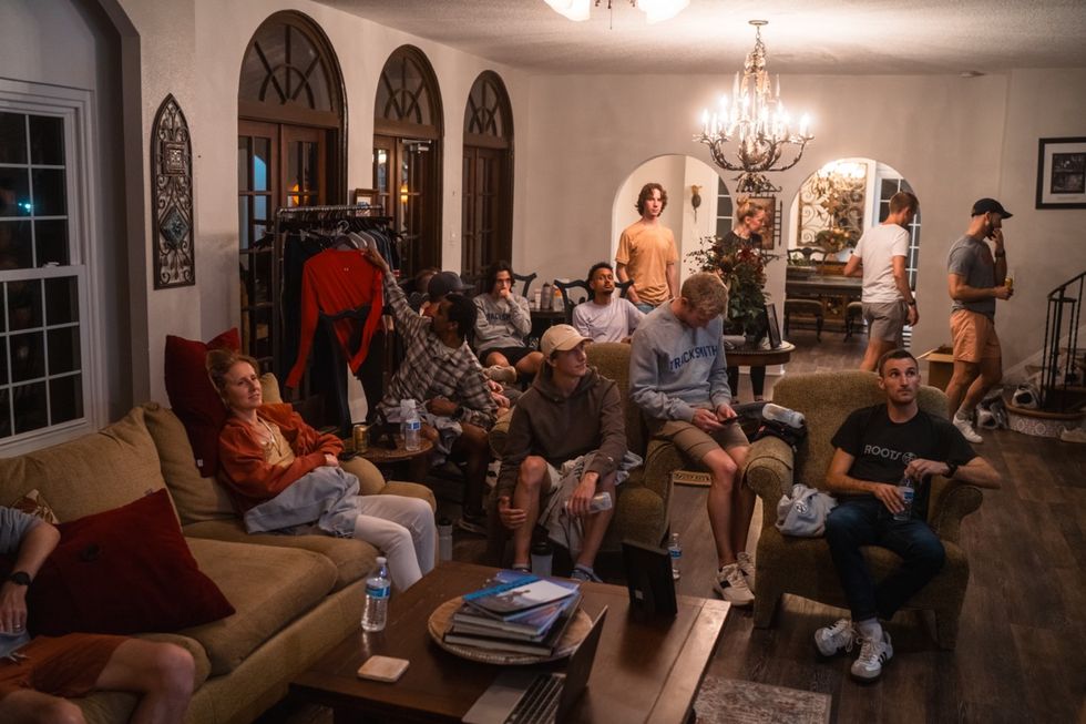 a group of people sitting in a living room