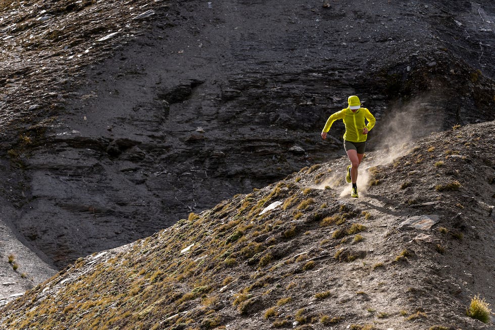 a person running on a rocky terrain