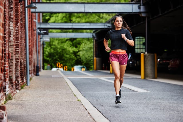 a woman running on a street