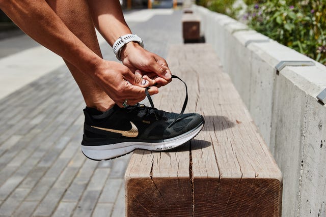 a person tying a shoe