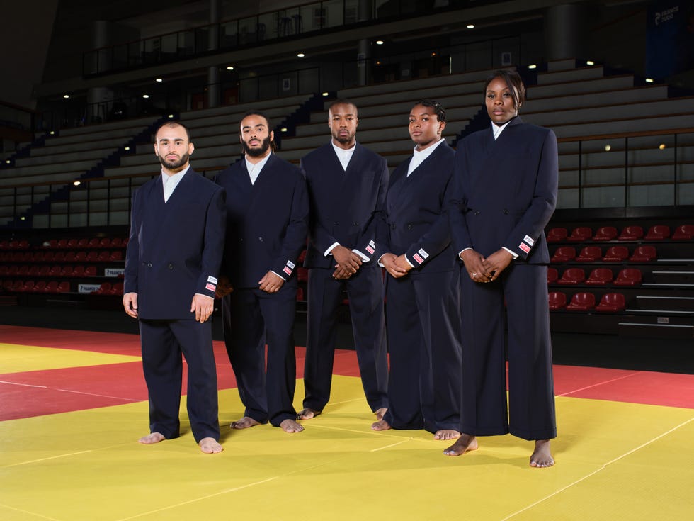 a group of men in black suits