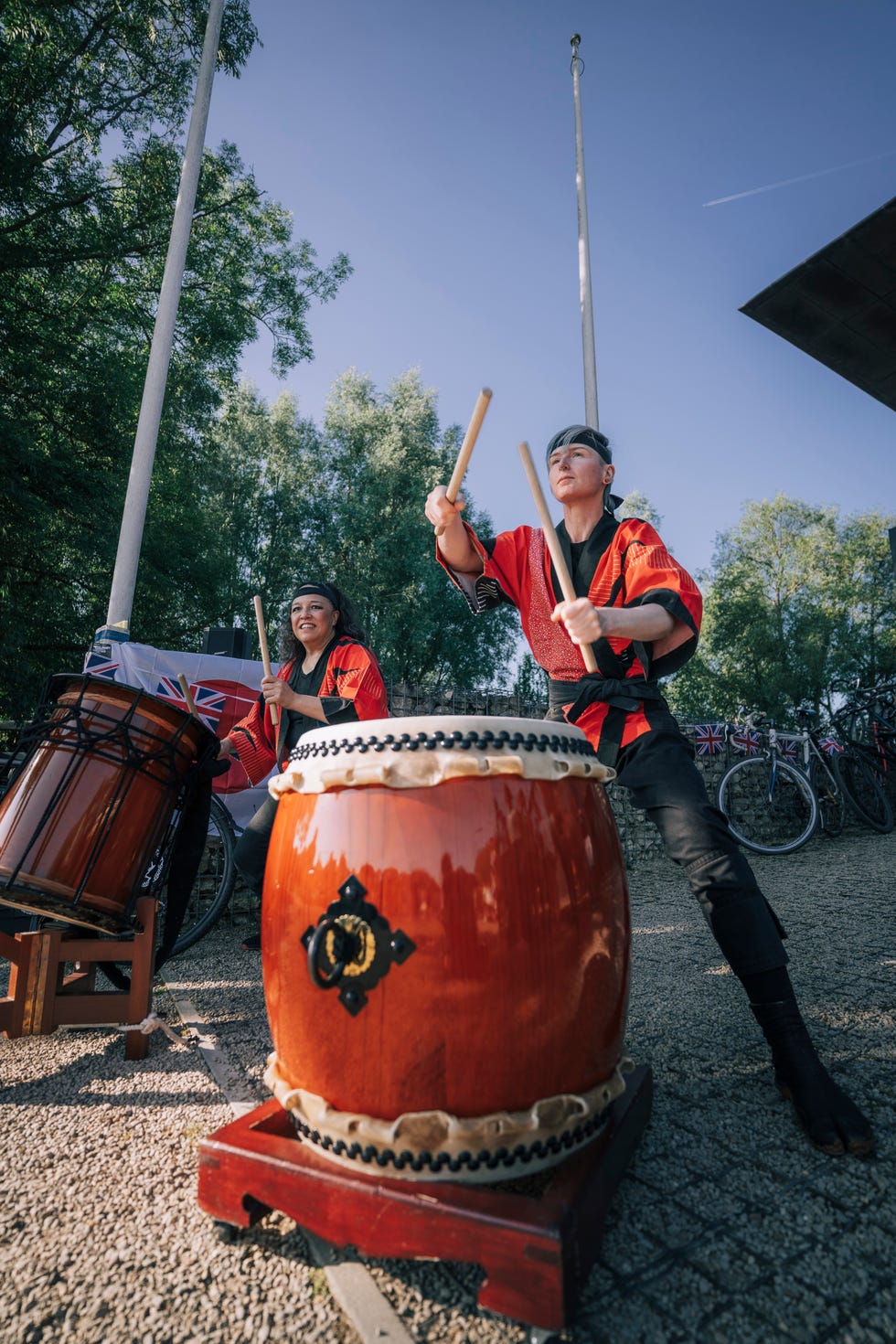 japanese taiko drumming performance with participants in traditional attire