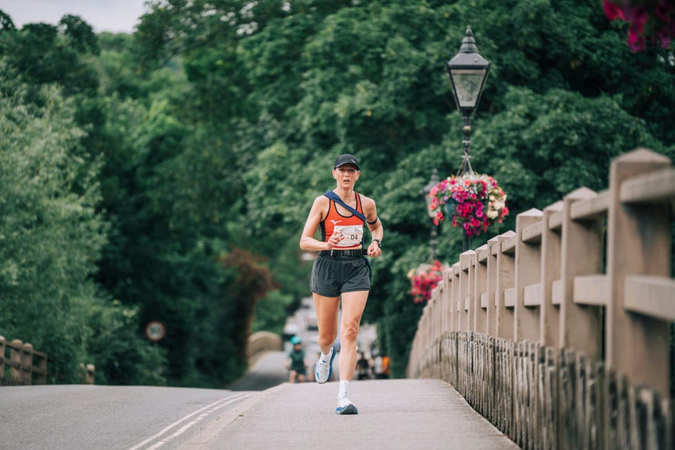 runner participating in a marathon on a bridge