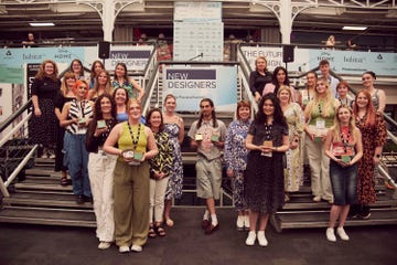 a group of graduate designers at a trade show