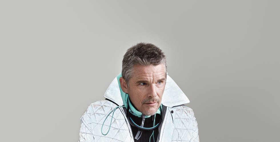 ethan hawke wearing a high collared quilted jacket