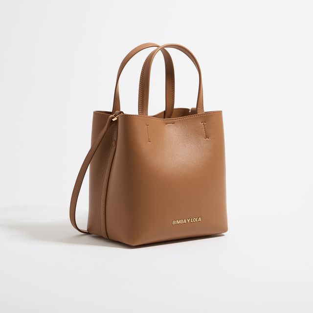 a brown handbag on a white background
