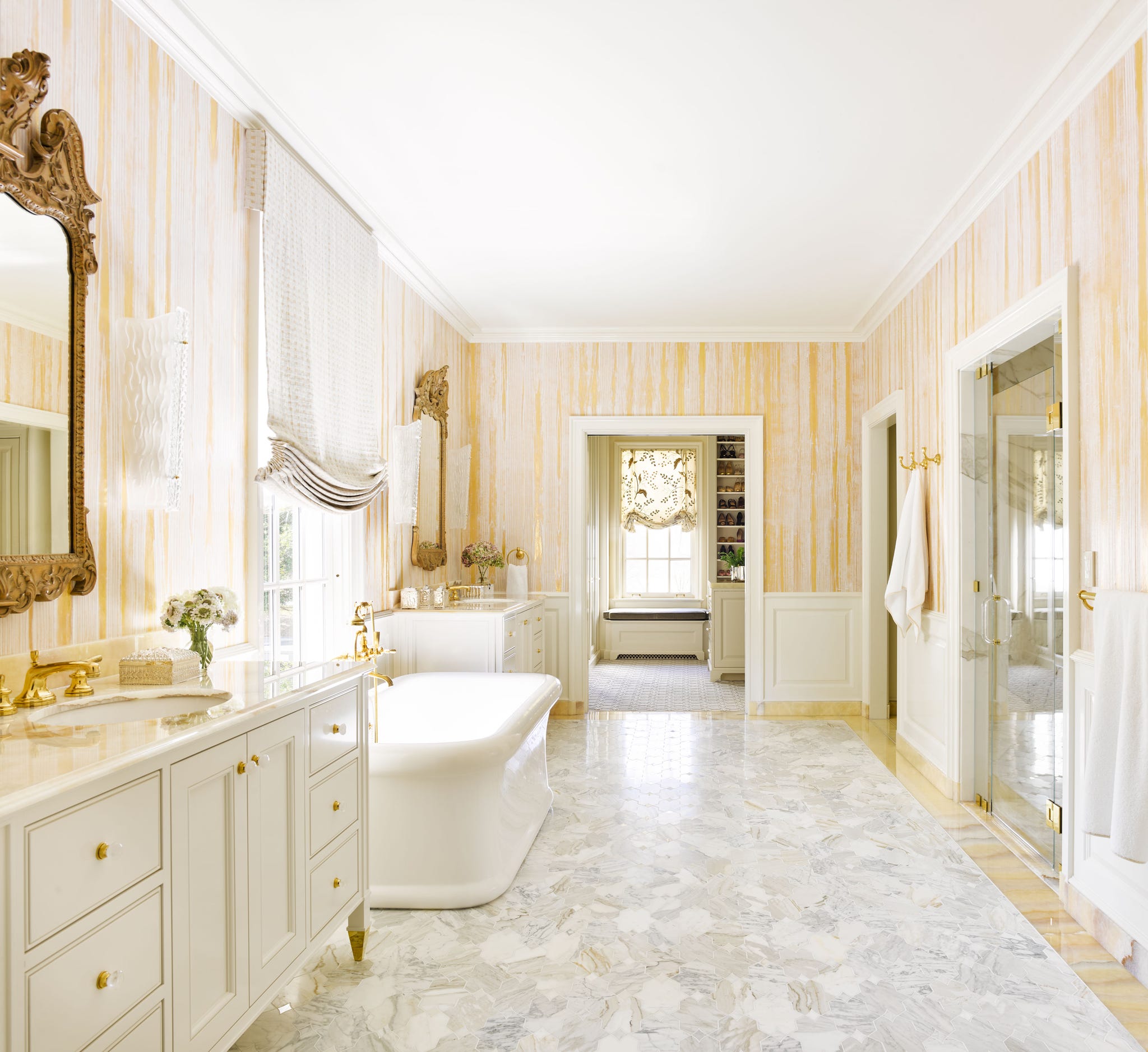 luxurious bathroom with marble flooring and elegant fixtures