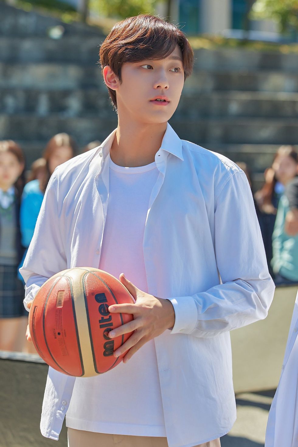 a person holding a basketball