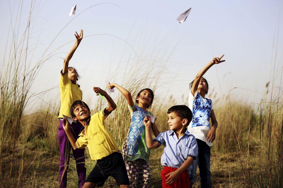 group of rural children playing outdoor in the nature