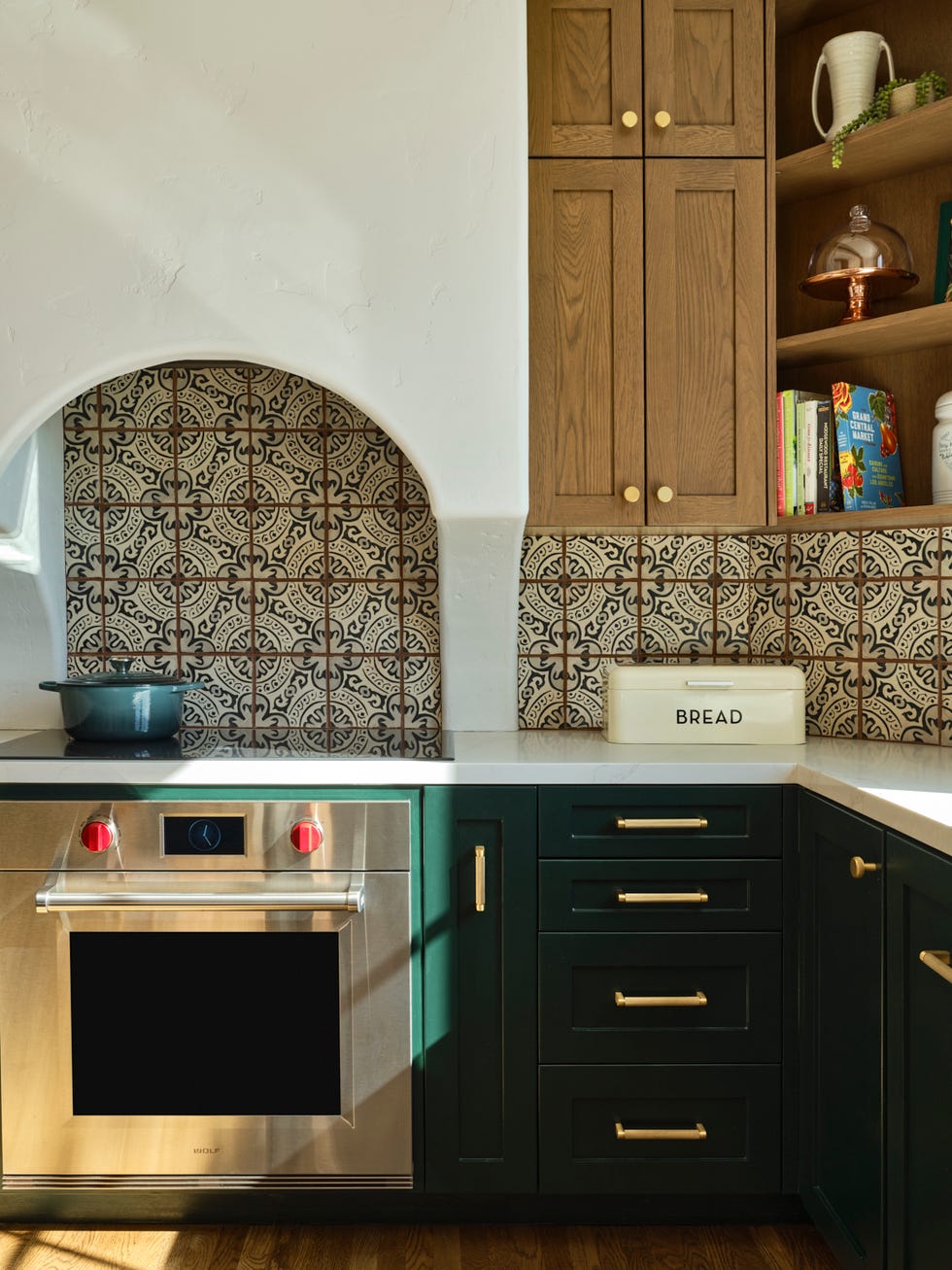 modern kitchen featuring patterned tile and stainless steel appliances