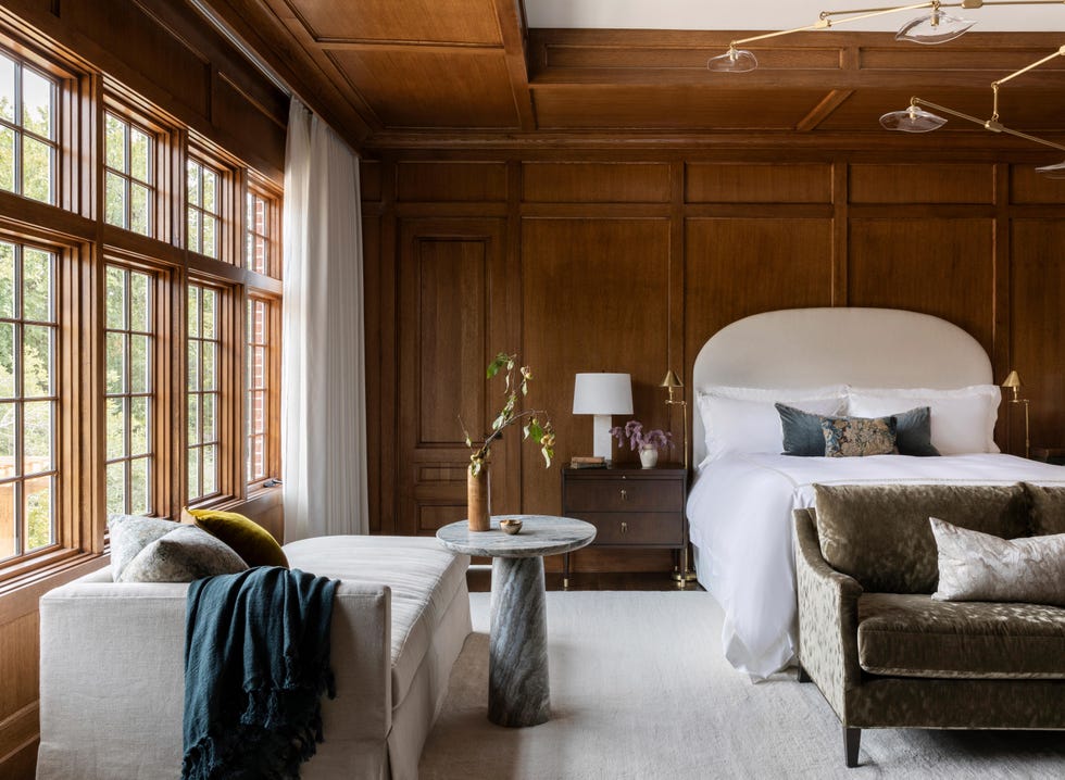 bedroom with wood paneling