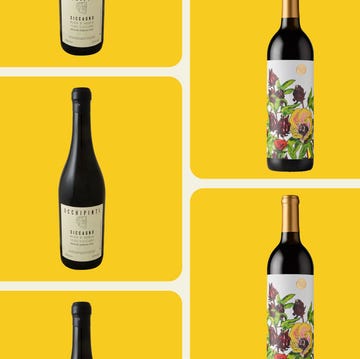assorted wine bottles on a bright yellow background assorted wine bottles on a bright yellow background