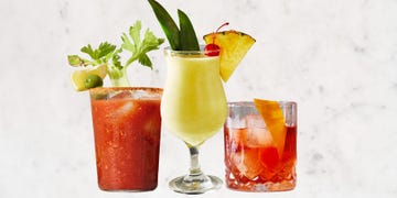 assortment of three cocktail drinks displayed against a neutral background