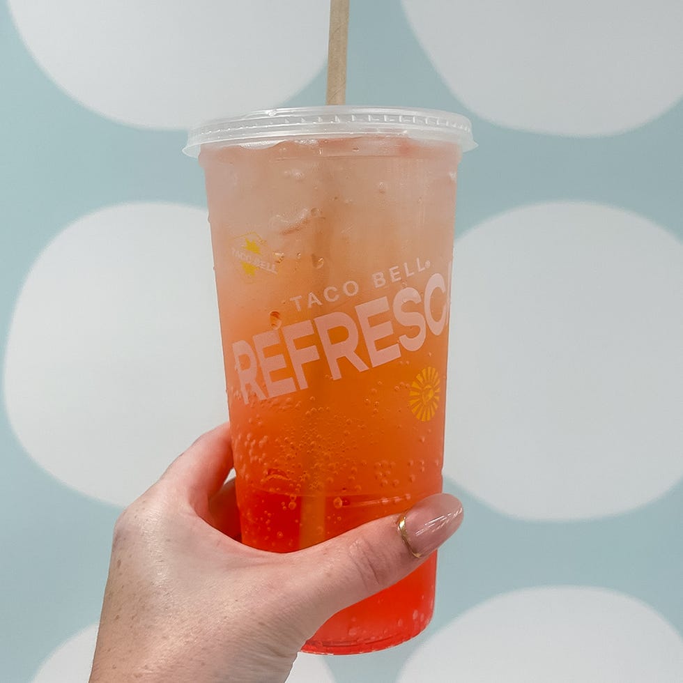 hand holding taco bell refrescas drink