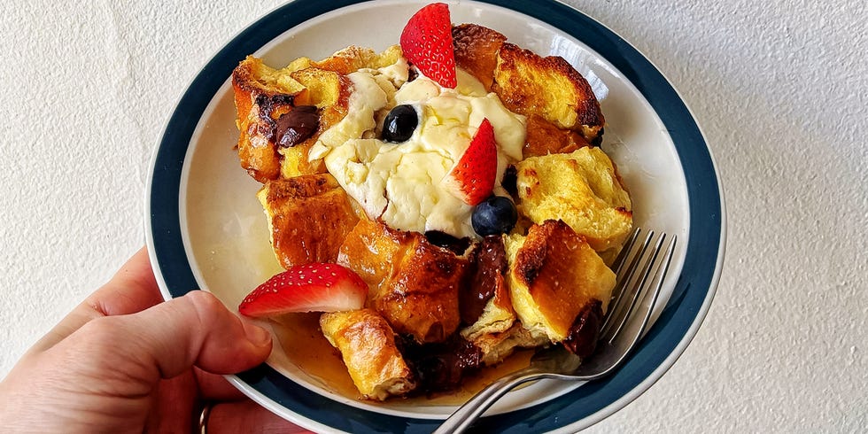 sheet pan french toast topped with ricotta, chocolate chips, and fresh berries