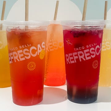 colorful beverage in plastic cups with straws colorful beverage in plastic cups with straws