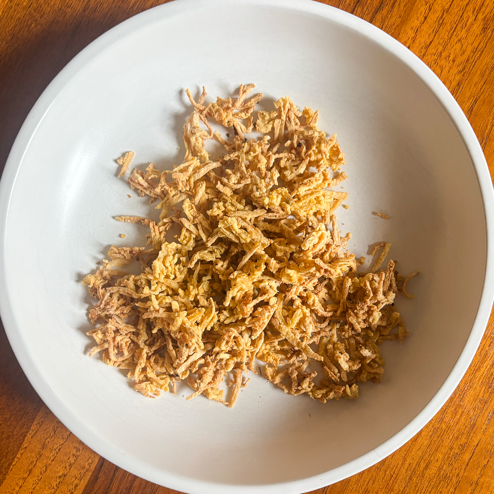 shredded tofu in a white bowl