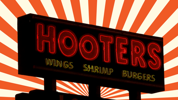 hooters sign against a graphic background of orange and beige rays