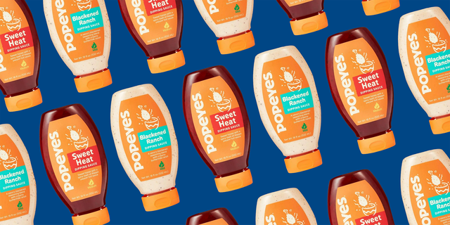 bottles of popeyes sauces on blue background