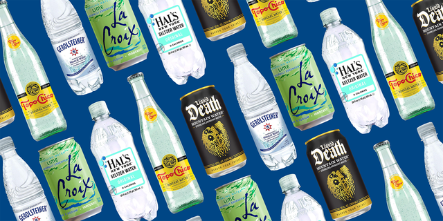 variety of sparkling water and mineral water bottles against a blue background