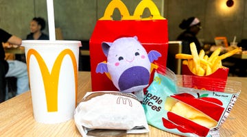 mcdonalds happy meal featuring food items and a plush toy