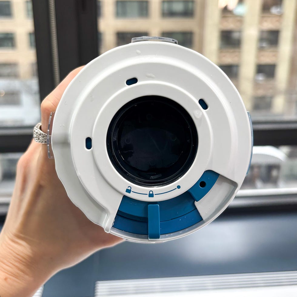 top view of a cylindrical device with a removable cap and operating mechanisms