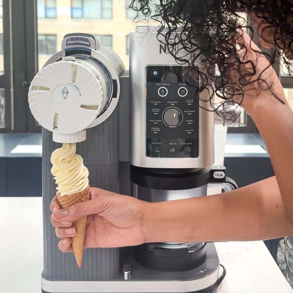 soft serve ice cream being dispensed into a cone from a machine