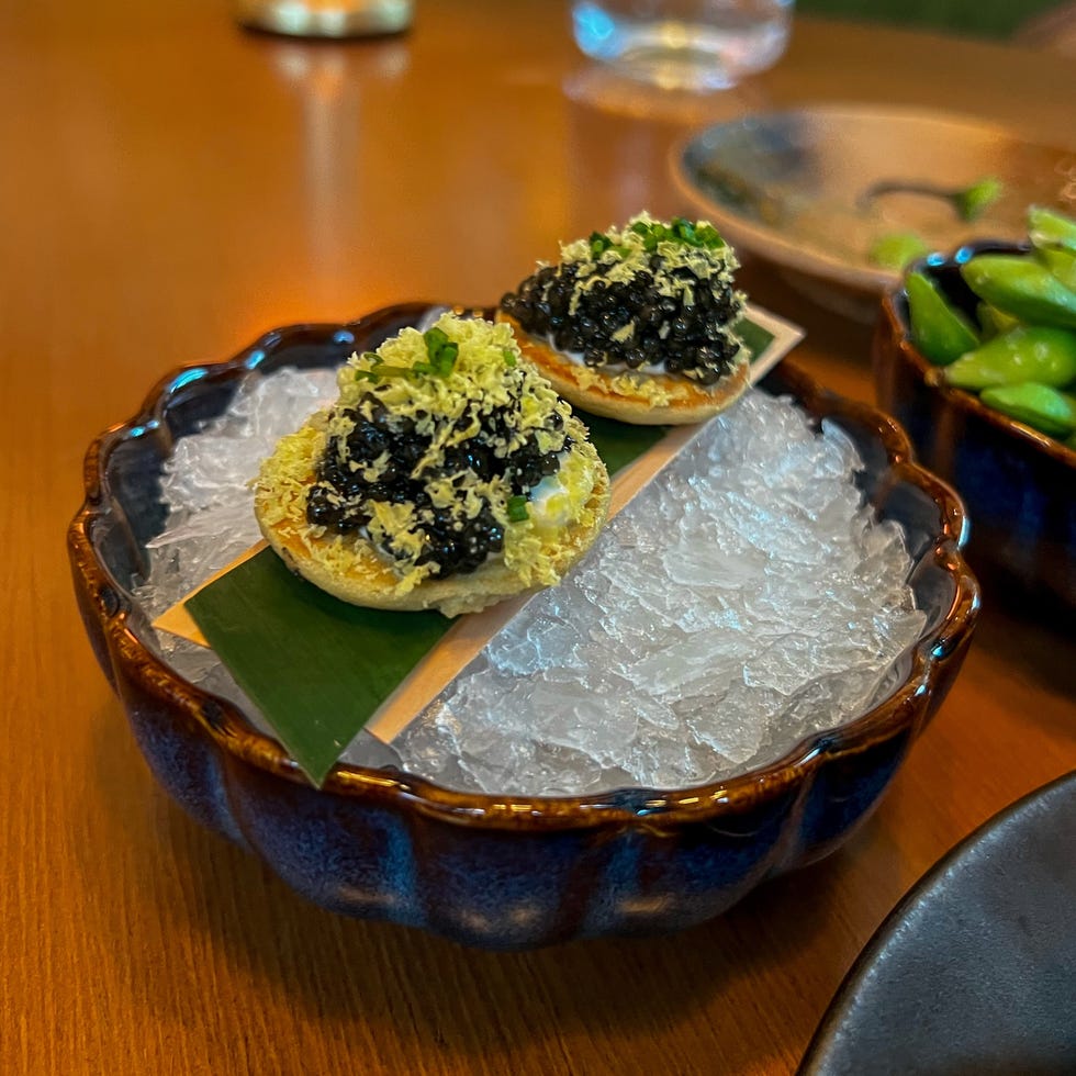 gourmet dish featuring two small servings on a decorative plate