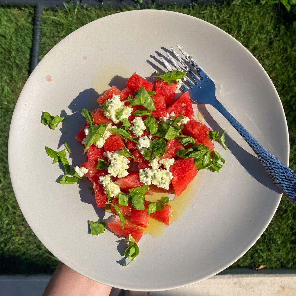 watermelon salad with basil and goat cheese on a plate
