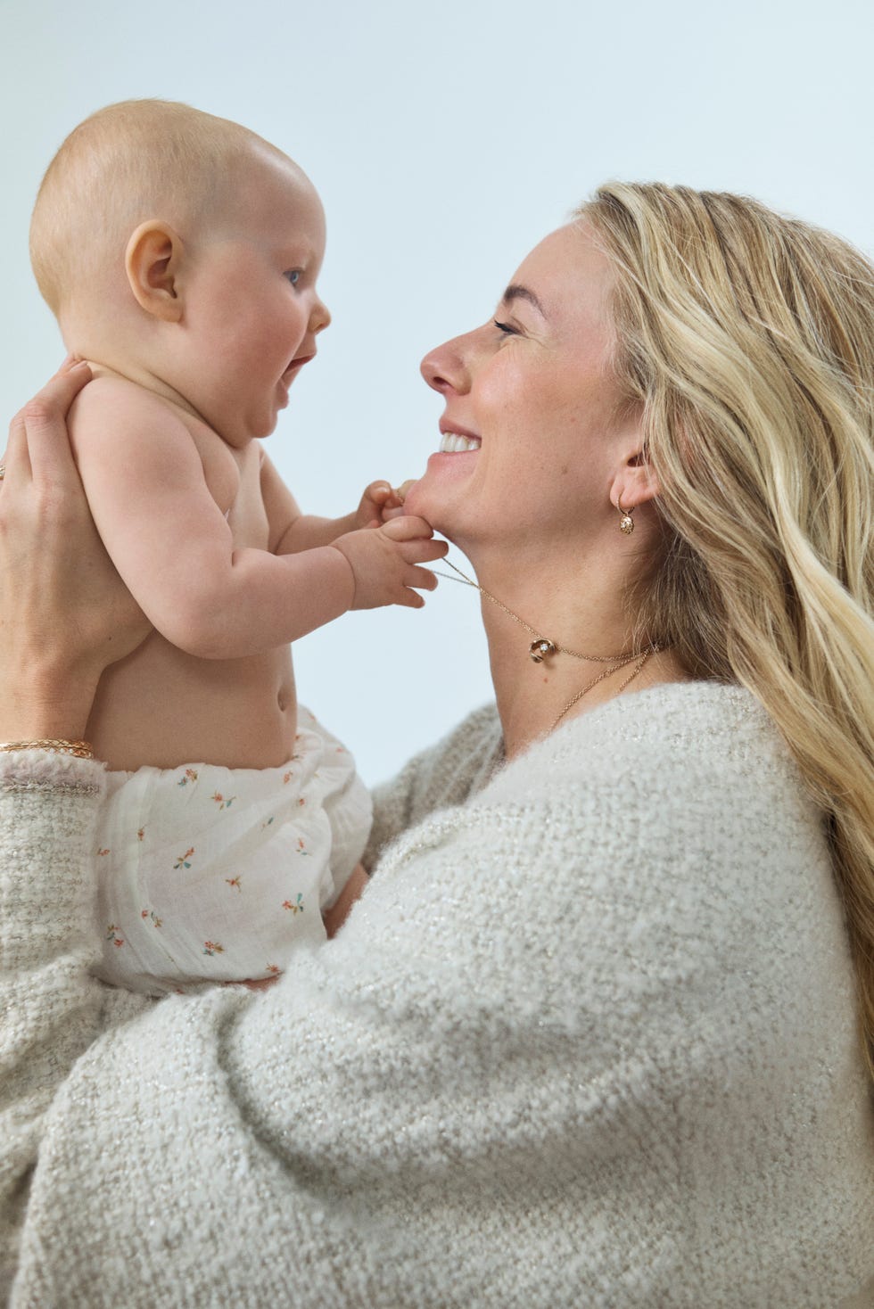 a mother holds her child.
