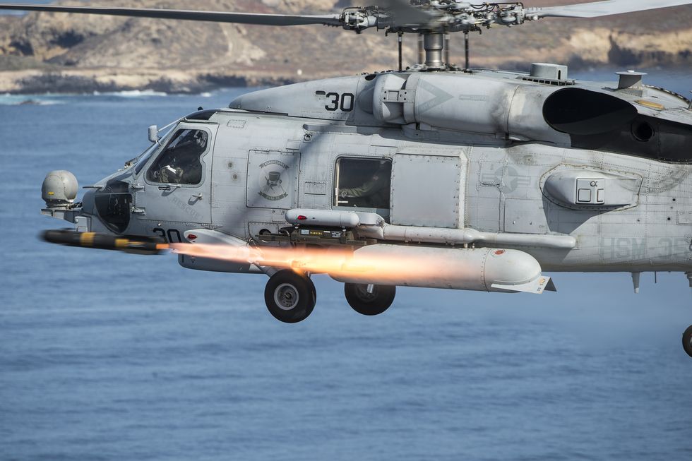 an mh 60r sea hawk helicopter, assigned to helicopter maritime strike squadron hsm 35, fires an agm 114m hellfire missile, april 5, 2016, near san clemente island, california, during a live fire combat training exercise hsm 35, the navy's first composite expeditionary helicopter squadron, flies the mh 60r sea hawk helicopter and mq 8b fire scout unmanned aircraft system us navy combat camera photo by mass communication specialist 2nd class arthurgwain l marquezreleased