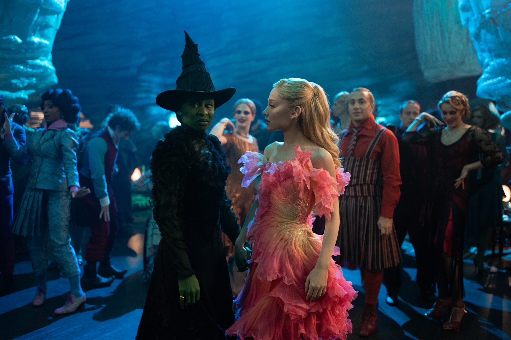 a scene featuring characters in elaborate costumes engaged in a lively atmosphere