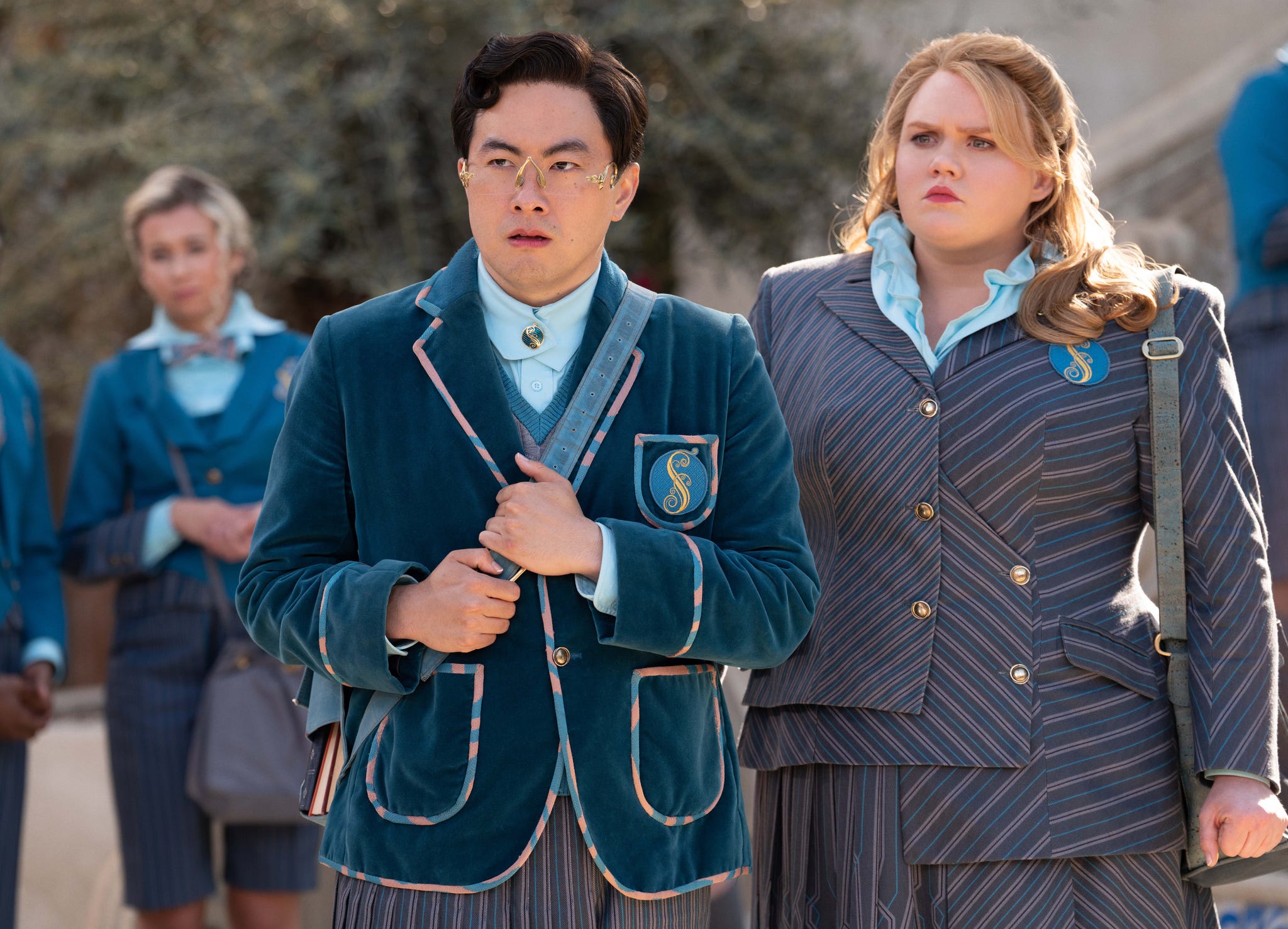 group of people in stylish uniforms standing outdoors