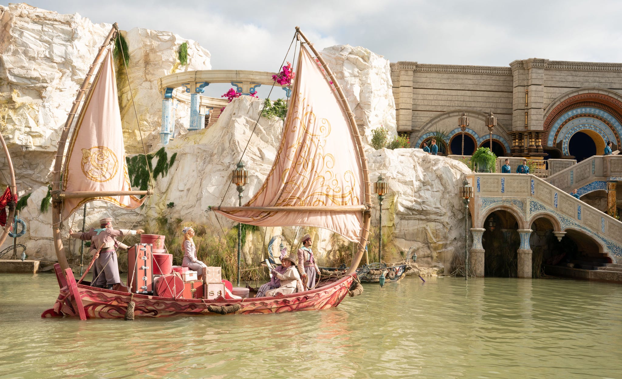 scene with a boat and decorative architecture near water