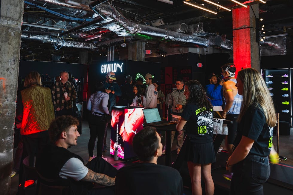 retail event showcasing athletic footwear with attendees interacting