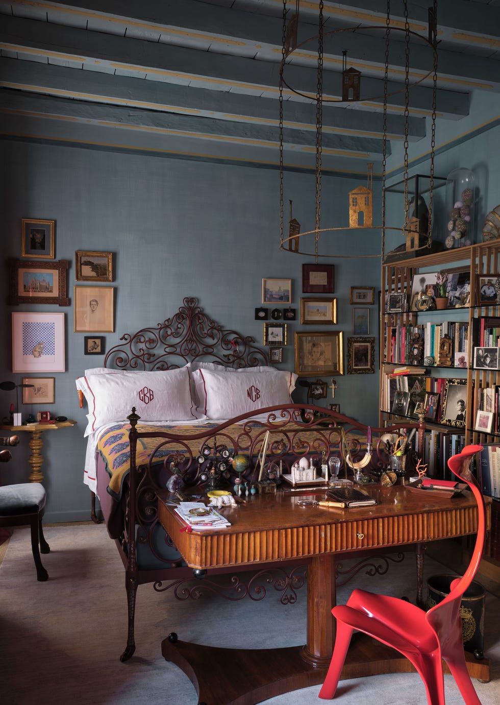 Cozy bedroom featuring a stylish bed and workspace.