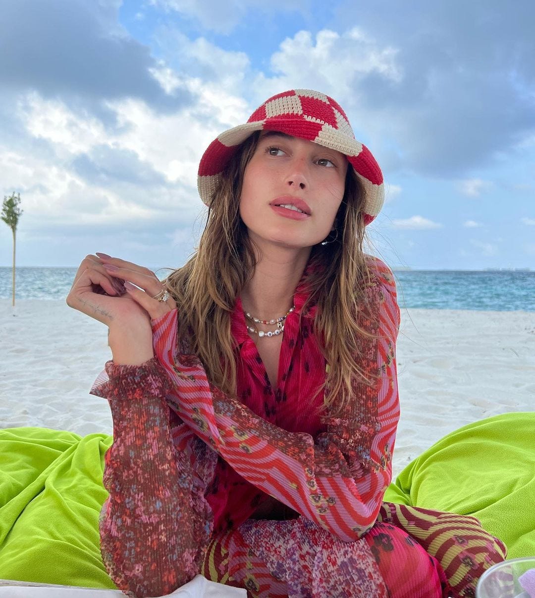 Hailey Bieber Wears Funky Yellow & Pink Checkered Hat At Beach