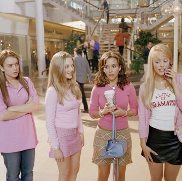 a group of girls in pink shirts