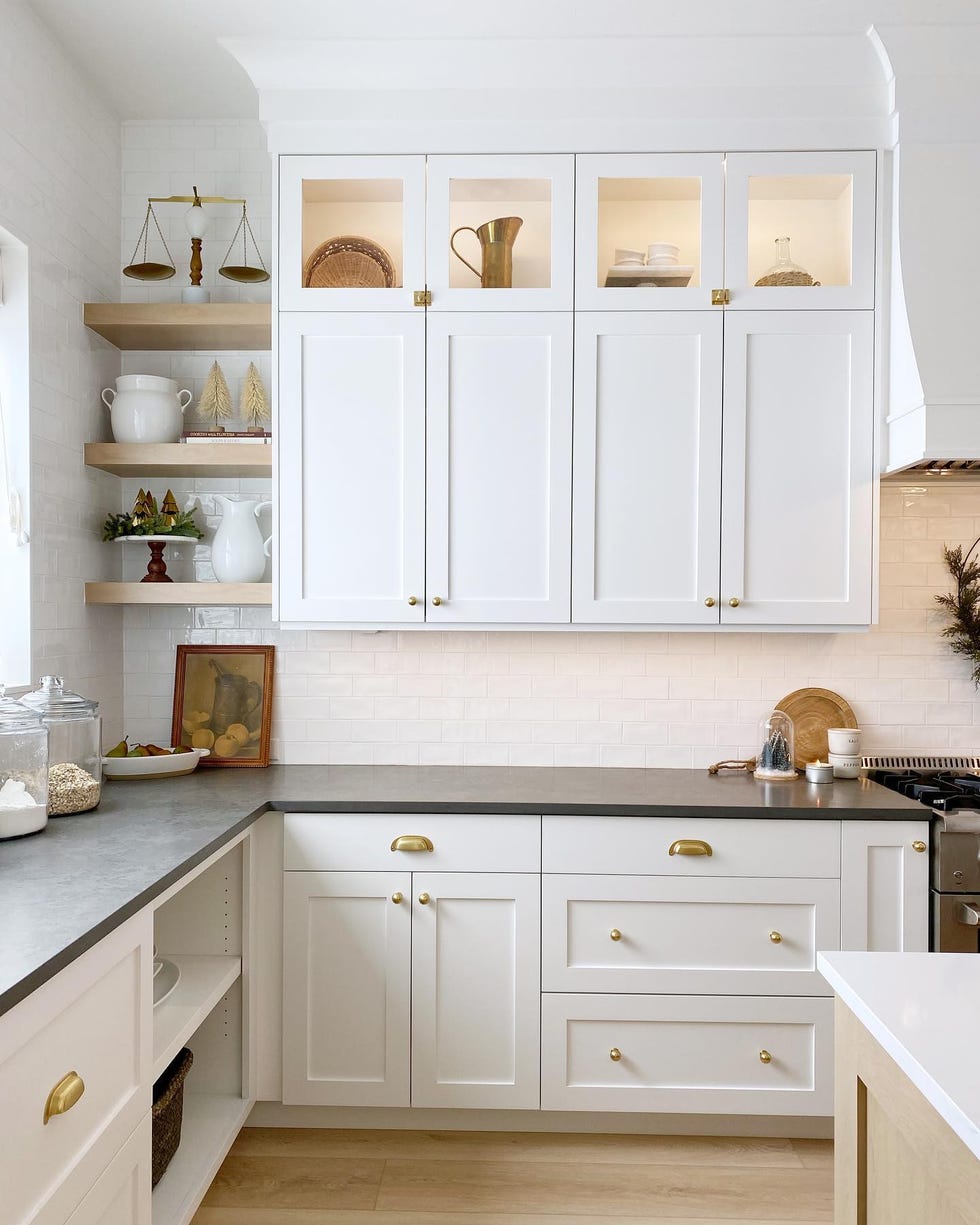 a kitchen with white cabinets a kitchen with white cabinets