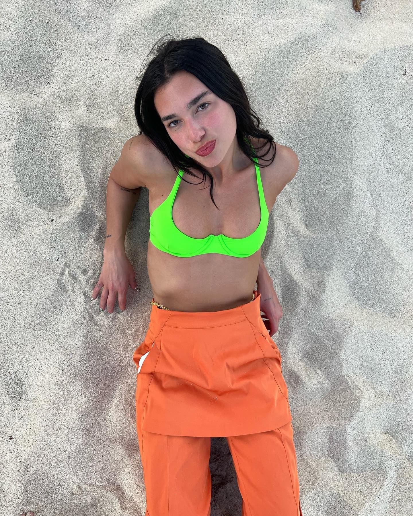 Where to Shop Dua Lipa's Asymmetrical Halter Top and Low-Rise Jeans