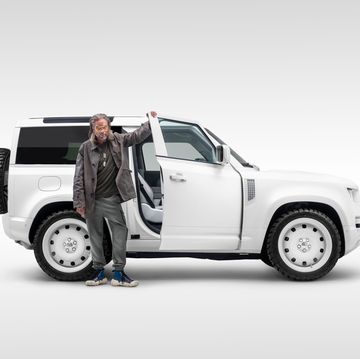 a person standing next to a white truck